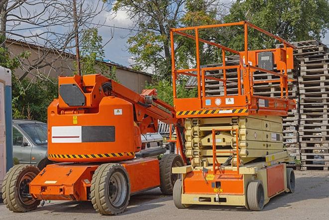 warehouse worker operating forklift to stack inventory in Coral Springs